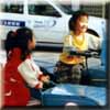 Girls playing on a motorcycle